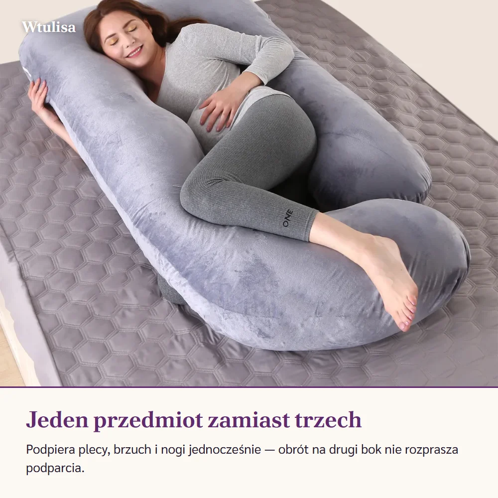 Kobieta w ciąży śpi na boku, otoczona szarą poduszką z obu stron